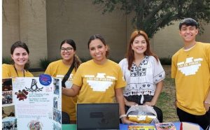 Students at info table during Hispanic Heritage event. 