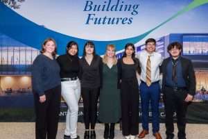 Group of students in front of "Building Futures" banner.